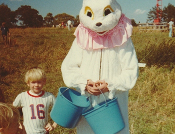 Young Michael standing beside Peter Cottontail for the WTLS & Tallassee Rescue Squad's Annual Easter Egg Hunt